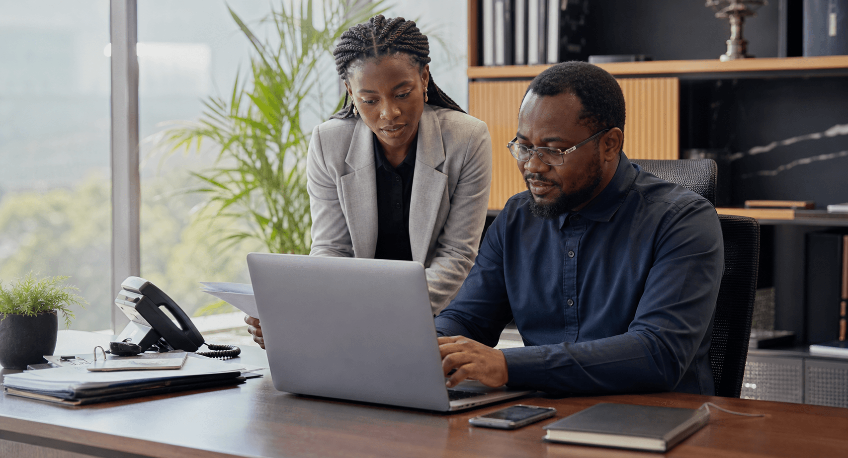 African finance team preparing local business payouts